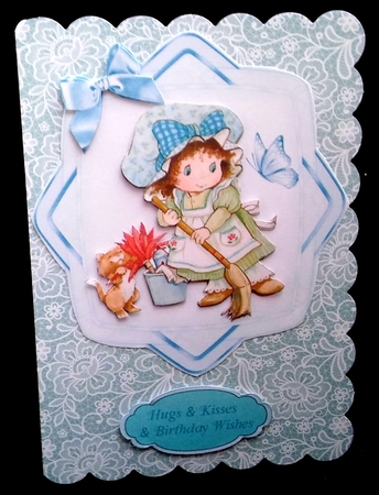 little bonnet girl gardening with her little kitten card front with blue bows by Diane  Hitchcox