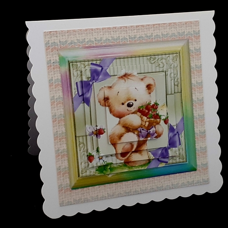 Cute teddy with corner bows in rainbow frame pyramids by Diane  Hitchcox