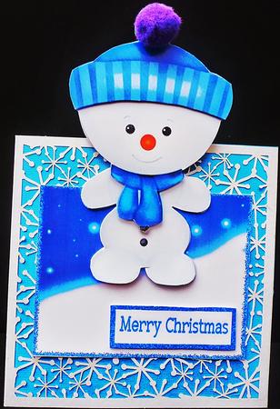Little Snowman in Turq Bobble Hat Over the Edge Crd by Diane  Hitchcox