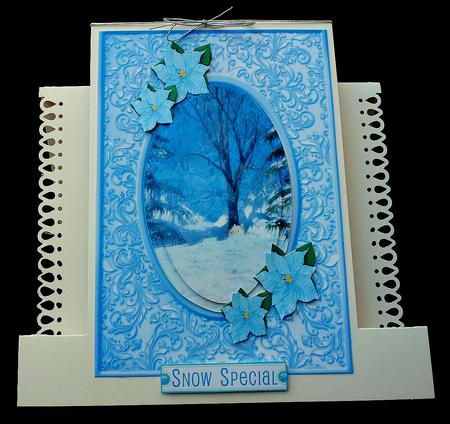 Christmas Scene with Blue Poinsettias Oval Pyramids by Diane  Hitchcox