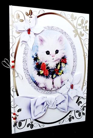 Little Kitten with Holly Wreath and Poinsettias by Diane  Hitchcox