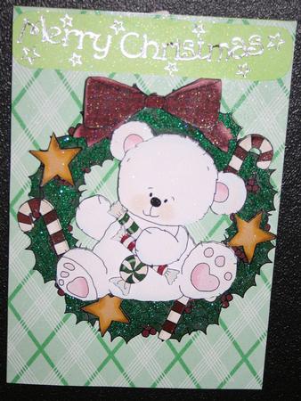 Christmas Polar Bear in Holly Wreath with Stars by Diane Sixsmith