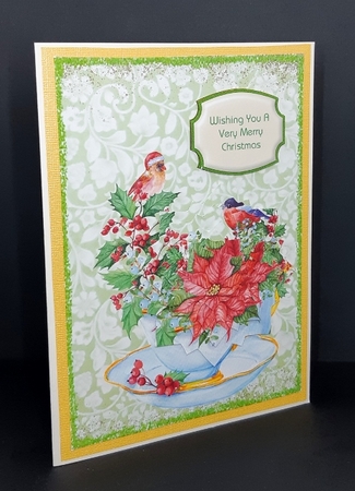 Cup of Poinsettias by Diane  Vermeer