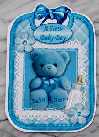 Cuddly Blue Teddy with Bottle on Lace Bib by Diane  Vermeer