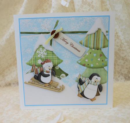 Penguins Having Fun Sledging by Diane Baldrey