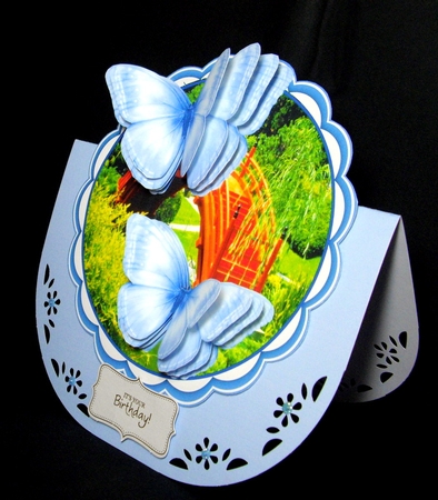 Beautiful Blue Butterflie on a scallopd mat  by Dianne Jackson