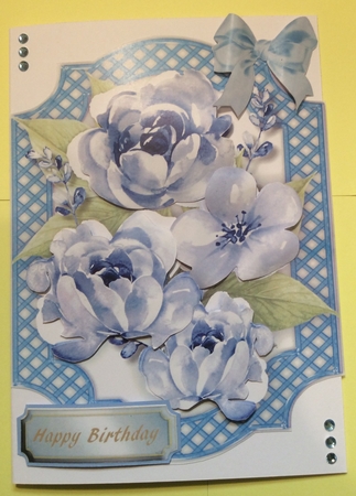 Lovely Blue Flowers in a Lattice Bracket  by Donna Girling