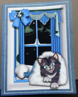 Kitten in Santa Hat in the Window by Donna Ritchie