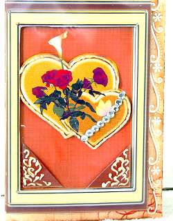 A4 Celebrate Two Gold Hearts with Flowers on Brown by Dorothy Manchester