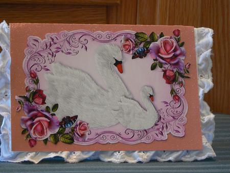 Pretty White Swans in Pink/purple Rose Frame A4 by Dorothy Manchester