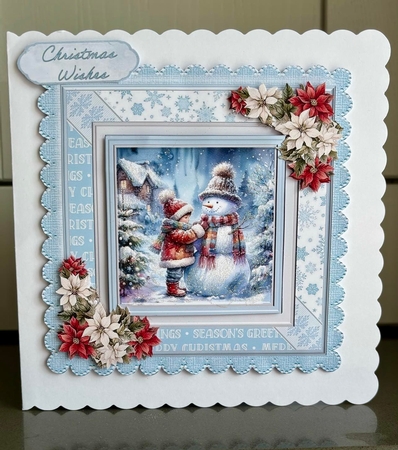 Snowman Building by Elaine Harmer