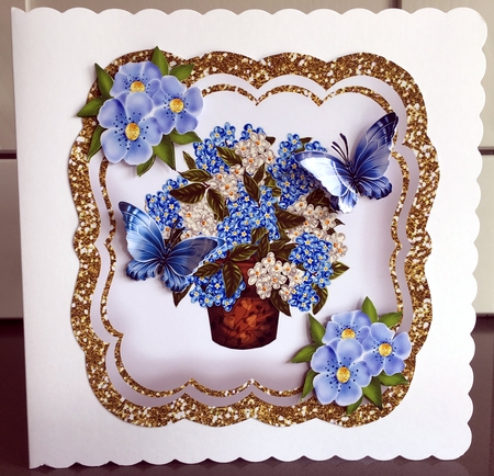 Pretty blue Hydrangeas in a vase with pretty blue butterflies by Elaine  Harmer