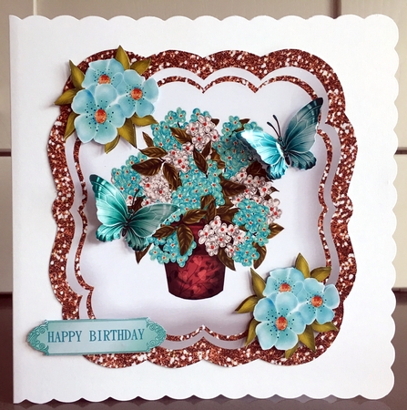 Pretty turq Hydrangeas in a vase with pretty blue butterflies by Elaine  Harmer