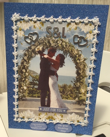 Bride & Groom Under green archway by Elaine Kettlewell
