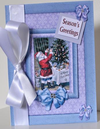 Who's Dressing the Tree Santa Card Front by Elaine Thompson