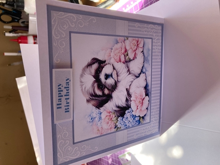 Dog With Blue & Pink Flowers by Lizzie Hartwell