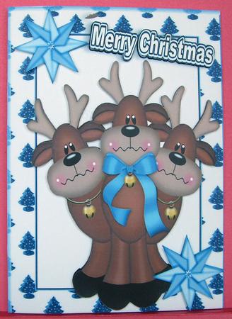 Cute Reindeers with Blue Bow in Tree Frame A4 by Eunice Roberts