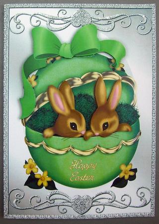 Easter Bunnies in a Green Egg with Bow A4 by Eunice Roberts