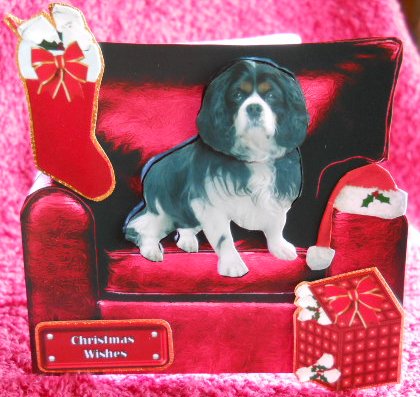 Christmas Cavalier King Charles Spaniel in an Armchair by Gail Pennycuick