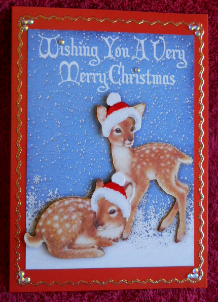 Cute Little Deers in the Snow in Santa Hats by Gail Pennycuick