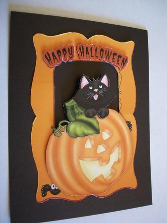 Puddicat with Spiders Hiding in a Pumpkin by Geri Stringer