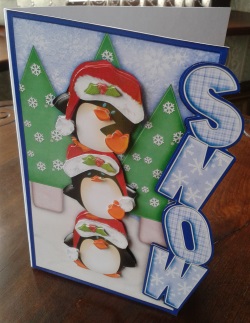 Balancing Penguins Christmas Over the Side by Gill Dean