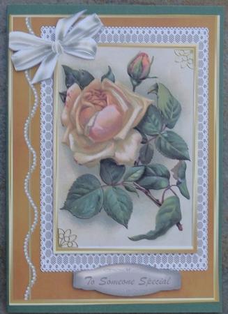 Lvely Coffee Rose on a Lace and Gold Mat  by Giselle Topper
