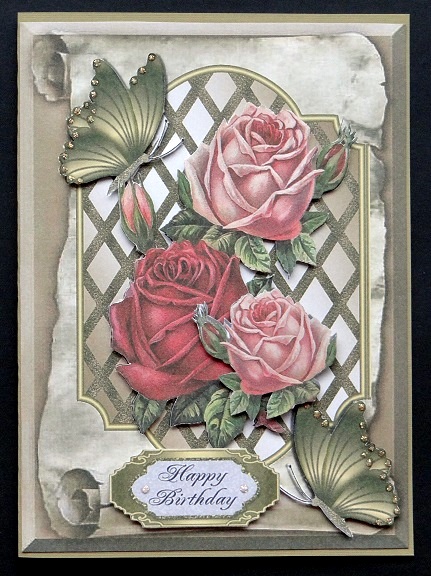 Pretty Roses on Lattice Frame on a Scroll with Butterflies by Giselle Topper