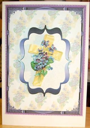 Yellow Ribbon Cross and Purple Flowers by GWYNETH GEORGE