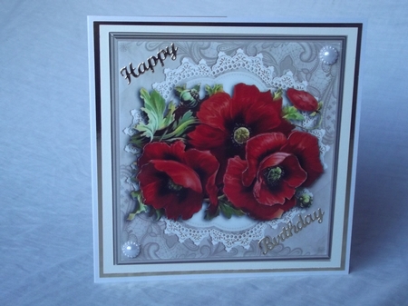 Lovely red poppies on vintage lace doily (light brown) by Gwyneth Morley