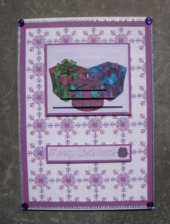 Pink Christmas Presents Pyramid Card Front by Hayley Griffiths
