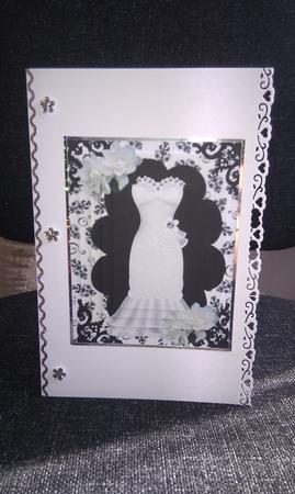 White Gown in Ornate Frame in Black/white Floral Background by Hayley Griffiths