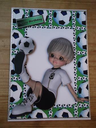 Boy Sitting Down Playing Footie in Green by Hayley Griffiths