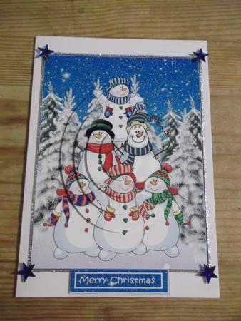 A Pile of Snowmen Oval Pyramid by Hayley Griffiths