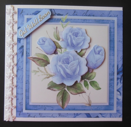 Mystic Blue Roses on a Vintage Mat  by Hazel Sumner