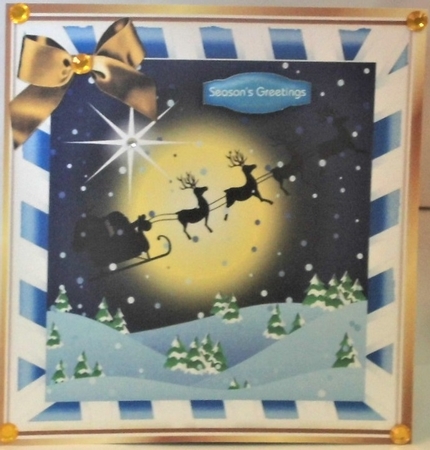 silhouette of santa and his sleigh flying, in blue stripe frame 8x8 by Hazel Underwood
