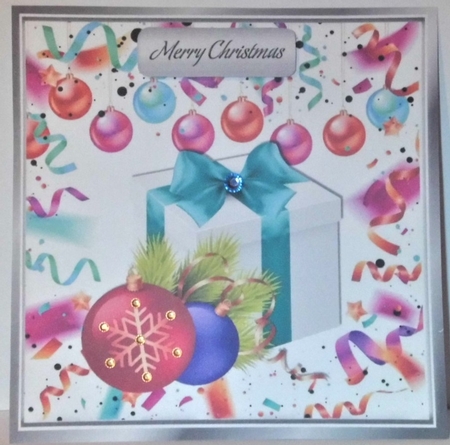 Festive card front 8x8 wih decorations and present with turq bow by Hazel Underwood
