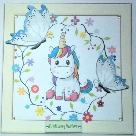 Cute rainbow unicorn with flowers in cream frame with blue butterflies 8x8 by Hazel Underwood