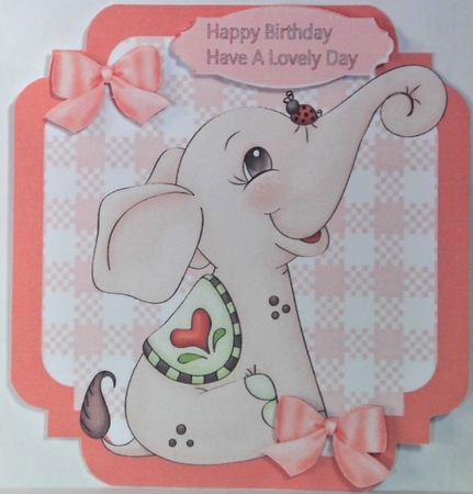 lovely little peach elephant with bows  on check 7x7 topper by Hazel Underwood