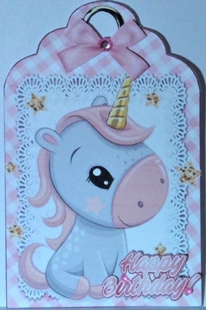 Cute little unicorn on lace tag/topper with pink bow by Hazel Underwood