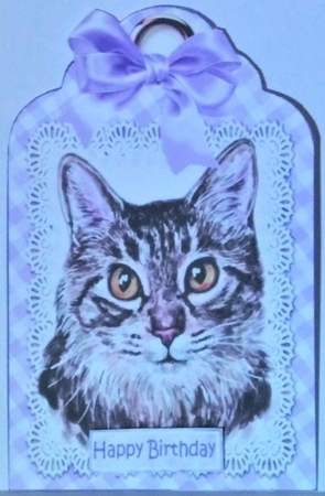 Pretty cat with lilac bow on lace tag by Hazel Underwood