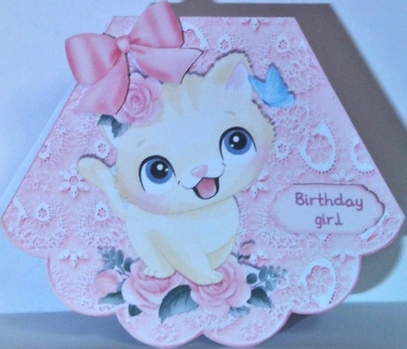 Cute kitten with roses on lace rocker by Hazel Underwood