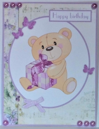 Birthday greeting card with a bear with a gift by Hazel Underwood