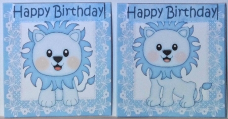 4 Cute litte blue lions on lace toppers by Hazel Underwood