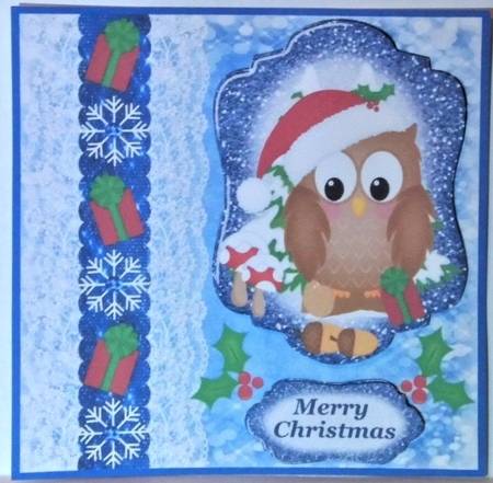Blue Christmas present owl card front by Hazel Underwood