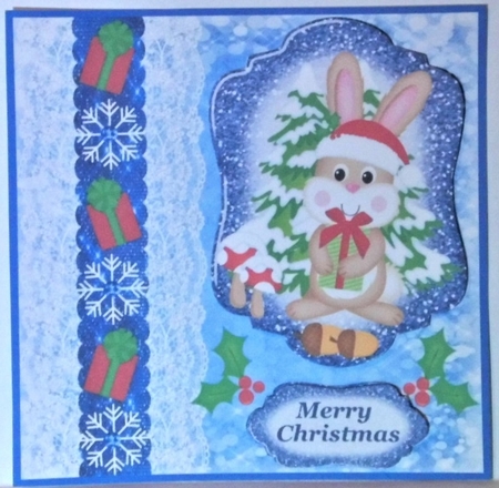 Blue Christmas present rabbit card front by Hazel Underwood