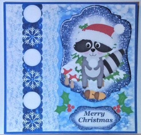  Blue Christmas raccoon snowball card front by Hazel Underwood