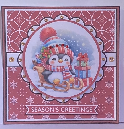 Penguin on sledge decoupage christmas card by Hazel Underwood