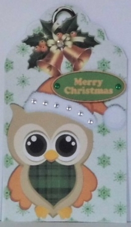 cute owl in gold santa hat on a snowflake tag with bells by Hazel Underwood