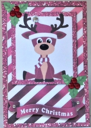 Cute reindeer in pink stripe glitter frame card front with holly by Hazel Underwood